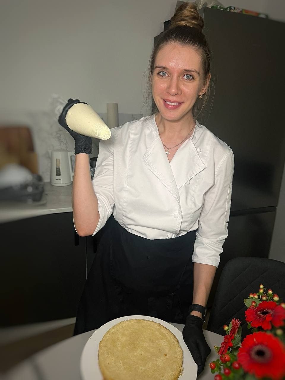 Maryna holding a piping bag