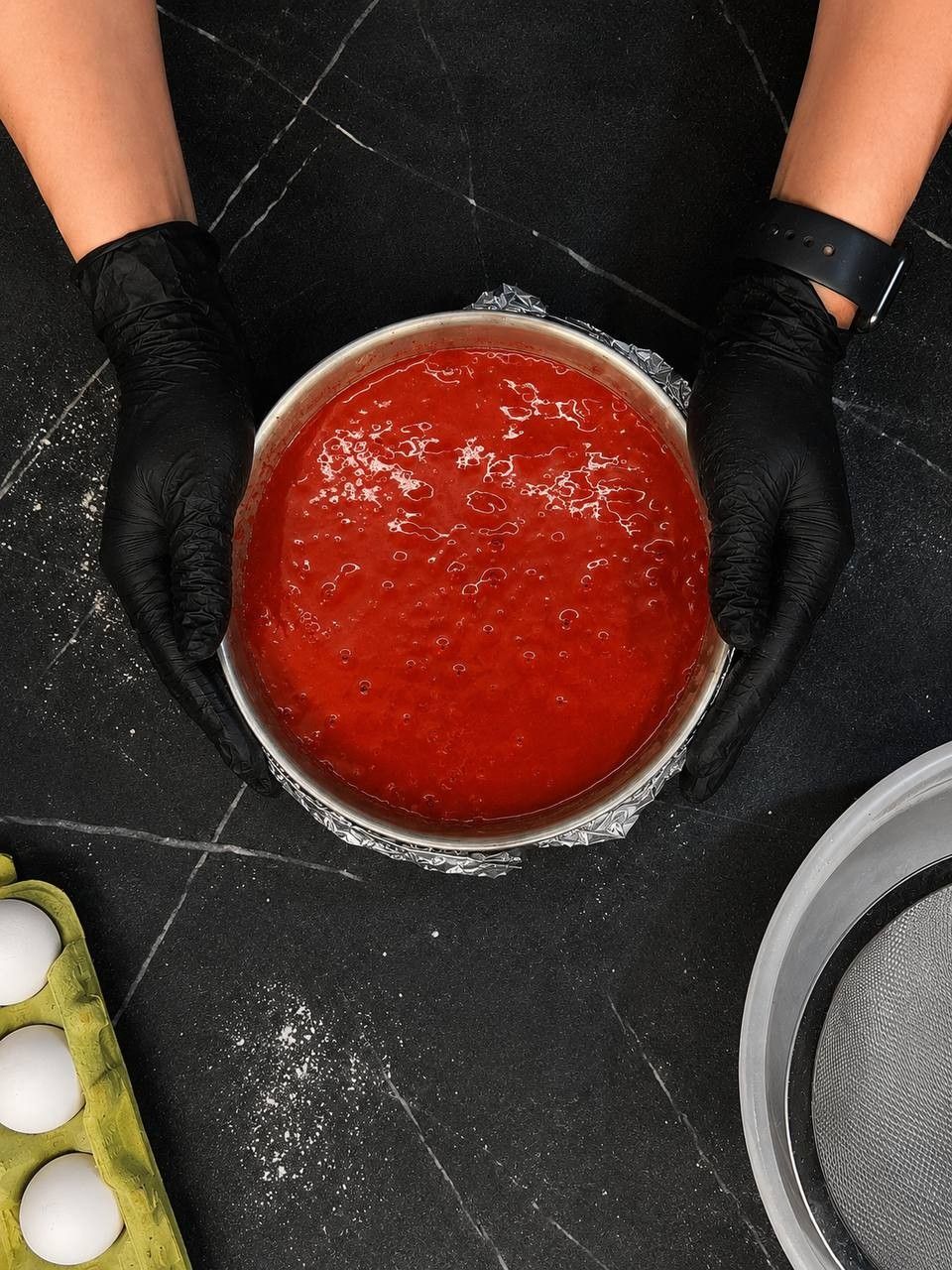 Red velvet batter in the baking tin, top view